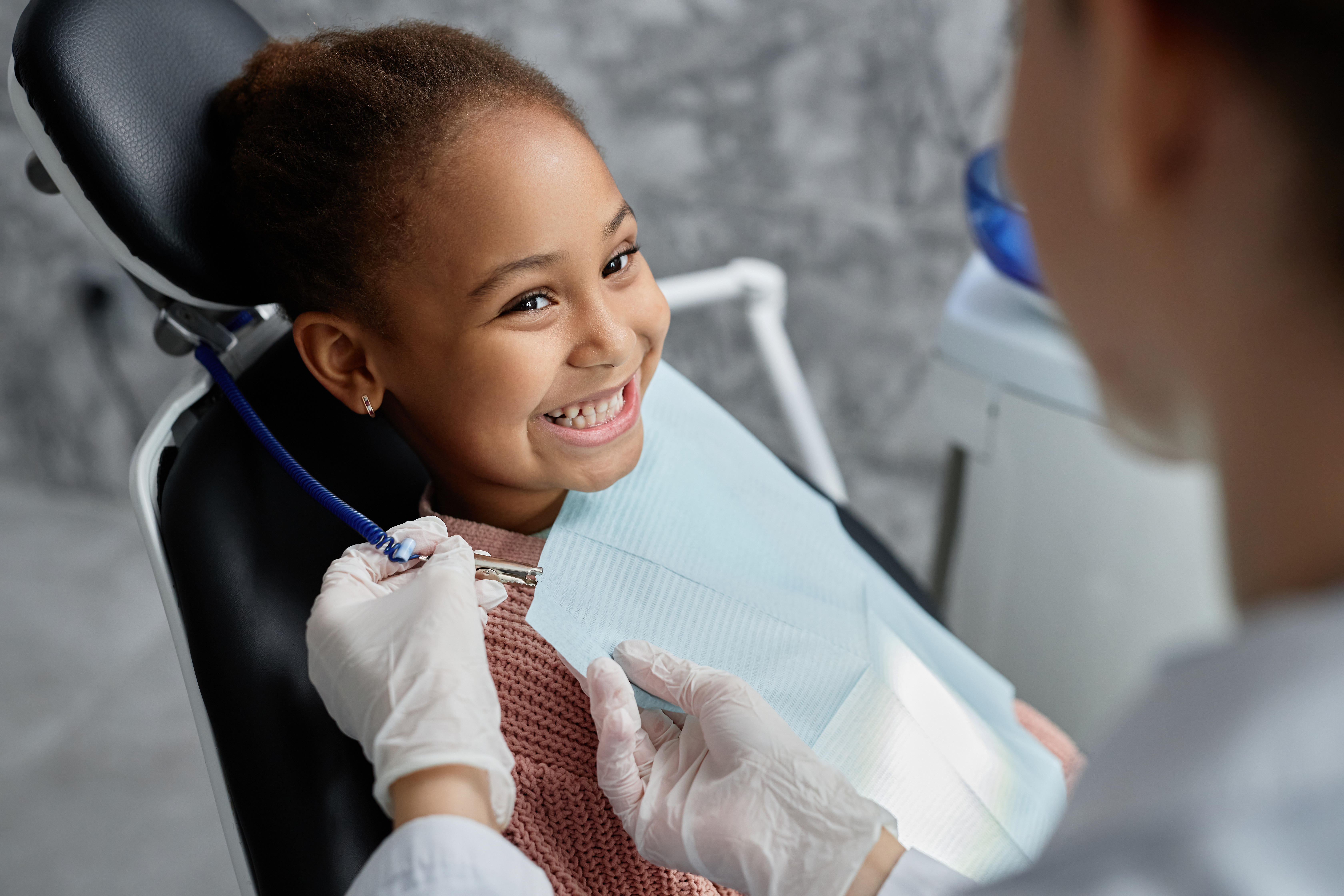 Smiling child at pediatric dental appointment